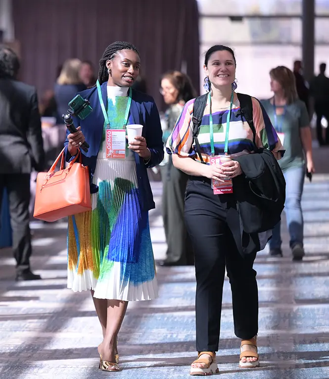 Two OFN Conference attendees walking and talking in between sessions