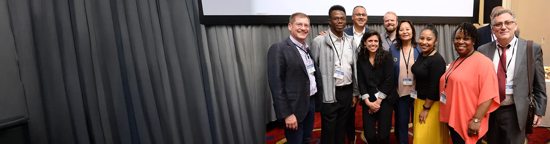 Members of the Accompany Capital team poses for a photo at a conference.