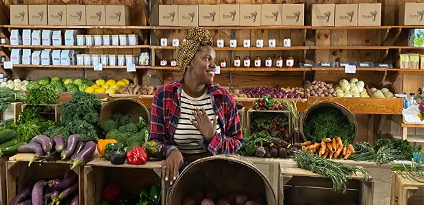 FarmerJawn owner Christa Barfield posing with produce