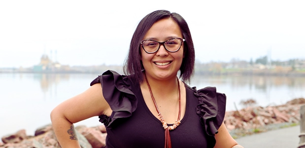 Kelly Shaggy standing by a waterfront