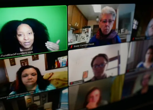 Screenshot of a Zoom-led webinar showing 9 webcams of the attendees/speakers